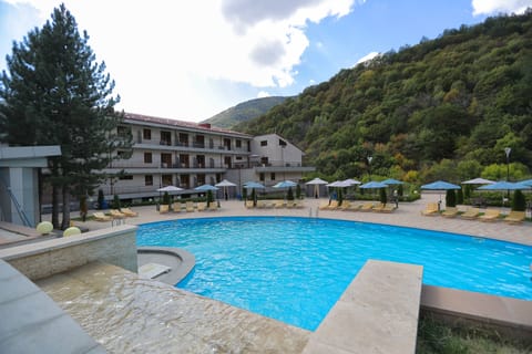 Indoor pool, outdoor pool, pool umbrellas, sun loungers