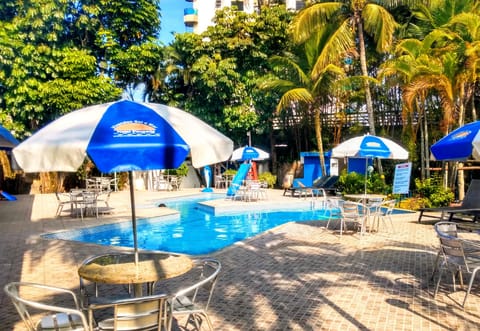 Outdoor pool, pool umbrellas, sun loungers