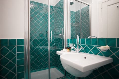 Superior Double Room, Terrace, Partial Sea View | Bathroom | Shower, rainfall showerhead, free toiletries, hair dryer