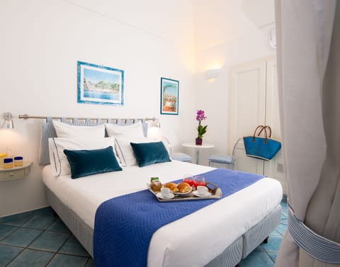 Standard Room, City View | Minibar, in-room safe, individually decorated, desk