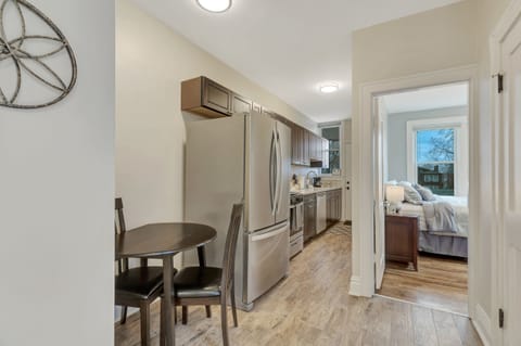 A view of the kitchen and entrance into the back bedroom.