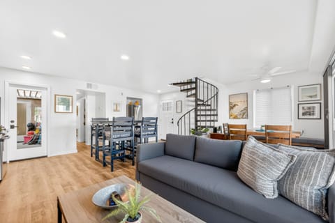 Spacious open living and dining area, perfect for family gatherings, relaxing after the beach, and enjoying quality time in a bright, airy environment.