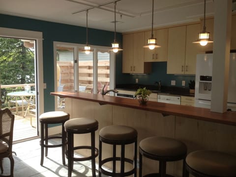 New custom kitchen with deck facing harbor