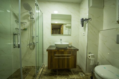 Shower, free toiletries, hair dryer, slippers