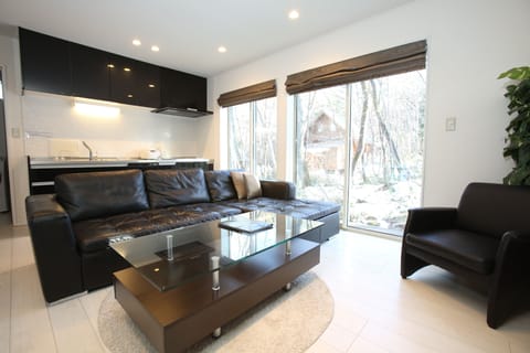 Comfort Chalet, 2 Bedrooms | Living area | Flat-screen TV, heated floors