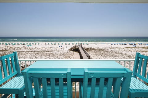 Balcony View - Wooden boardwalk pictured is the private walkway to the water and your complimentary beach service setup.