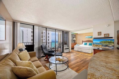 Unwind in this vibrant living space, offering breathtaking ocean views from your private balcony, a pull-out sleeper sofa, and a 40" smart TV for ultimate relaxation.