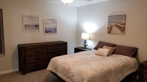 "Beach themed" bedroom #2 with pillow top queen bed.  All bedding is furnished.