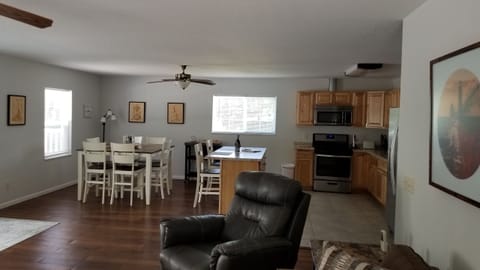 Full kitchen with a breakfast bar and high top table.  All stainless appliances.