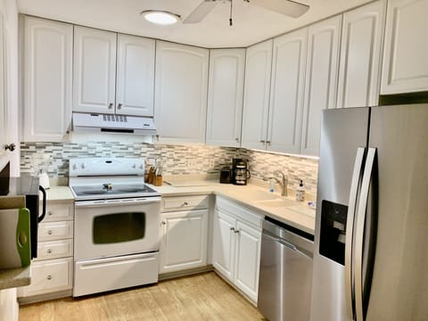 Cook "at home" in this well stocked kitchen including a Keurig coffee maker