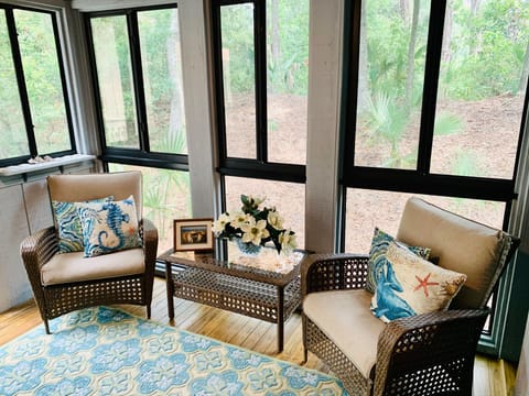 Screened porch is a great place for morning coffee or an evening beverage