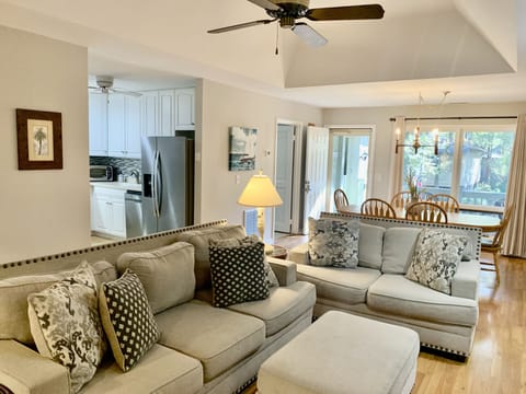 Living room looking back to the dining room and kitchen area