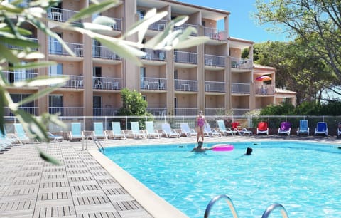 Lounge by the pool in the sunshine.