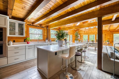 View of our state-of-the-art kitchen with double ovens, wine fridge, and island