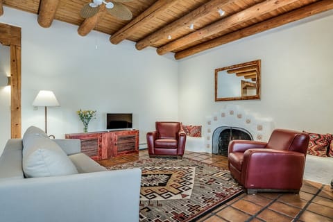 Elegant living room with wood burning fireplace and comfortable seating