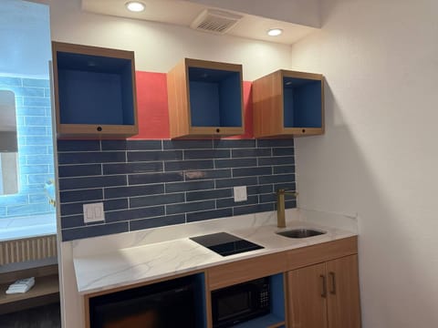 Suite, 2 Queen Beds, Non Smoking | Desk, laptop workspace, blackout drapes, iron/ironing board