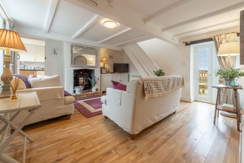 First & Last, Trimingham: Sitting room with electric flame stove