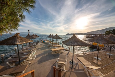 Private beach, white sand, sun loungers, beach umbrellas