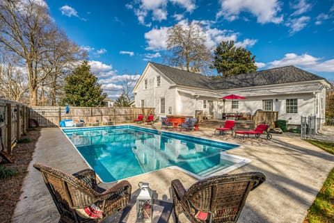 Pool area; lots of seating! Hot tub view in the back. 