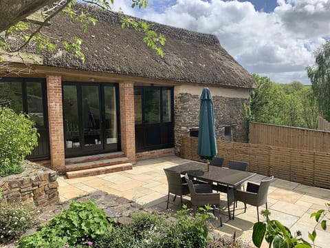 Enclosed patio garden with patio doors and steps down from living room