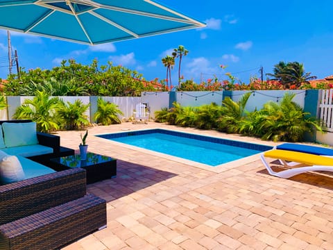 Tan away or relax by the pool under the UV protected lounge with a BULL grill.