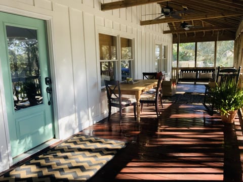 Front porch for relaxing after a day in the surf & extra seating at meal times.