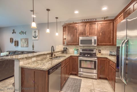 fully stocked kitchen including toaster, blender, standard coffee maker, and more.