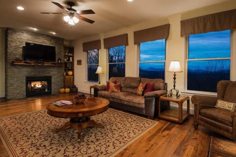 A wall of windows in the living room offers beautiful long range views. 