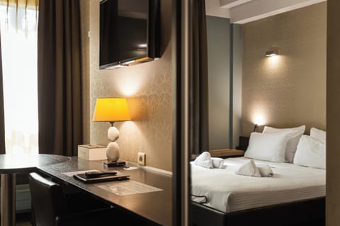Standard Double or Twin Room | Minibar, in-room safe, individually decorated, desk