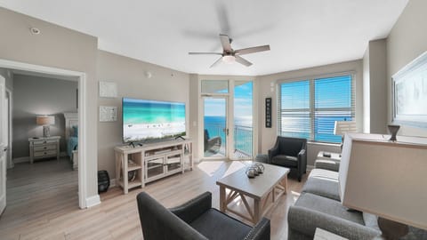 Relax in this spacious living room where ocean views stretch endlessly beyond your private balcony.