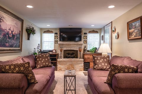 Living/sitting room features comfortable  Lazy Boy brand sofa and loveseat.