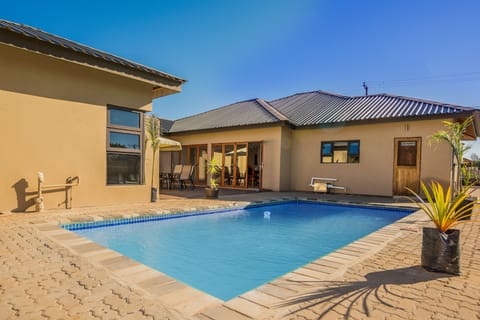 Outdoor pool, pool umbrellas, sun loungers