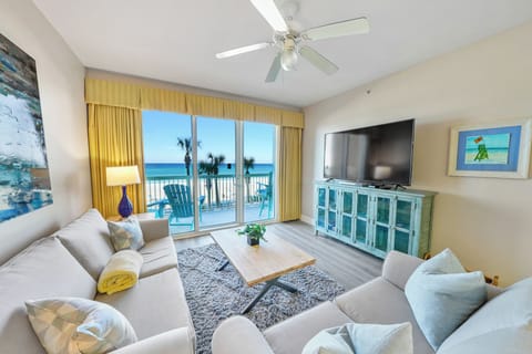 Relax in your bright living room with stunning ocean views and beach access from your private balcony.