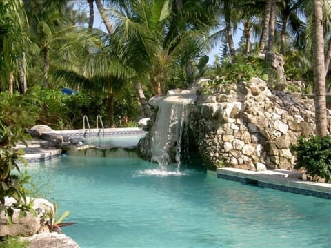 Relax in our waterfall pool - Just steps from Viola's Bar and Cafe