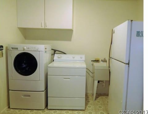 Laundry/ fridge - The laundry room doubles as a GREAT mud/snow room with its own outside entry.  Wet swim or snow clothes can go straight in!  There is also a laundry sink for those wet clothes from snow play or swimming.