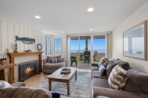 Cozy up by the fully functional fireplace—and enjoy your front row view of the ocean!