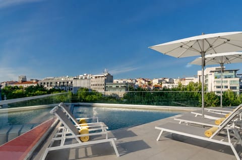 Outdoor pool, open 9:00 AM to 8:00 PM, pool umbrellas, sun loungers