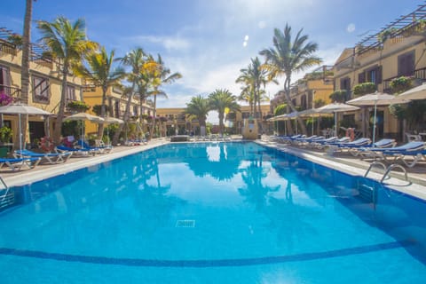Outdoor pool, a heated pool, pool umbrellas, sun loungers