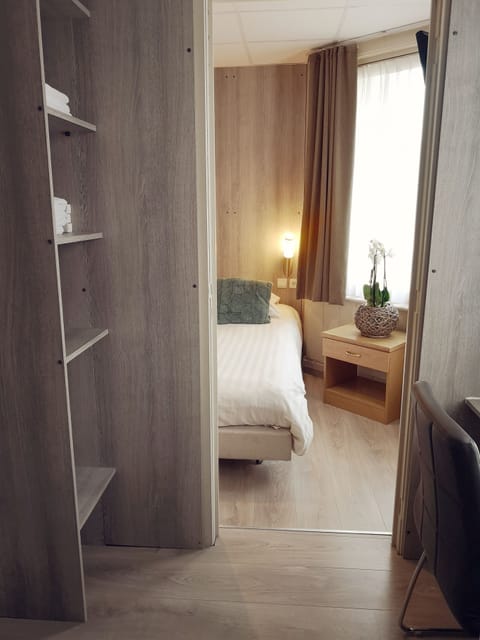 Family Triple Room | Blackout drapes, iron/ironing board, cribs/infant beds, free WiFi