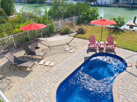 Back yard pool with seating