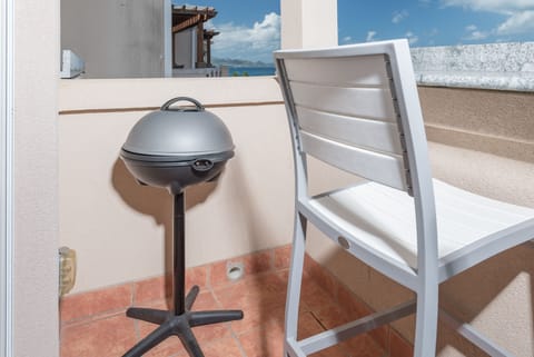 Electric grill on patio.