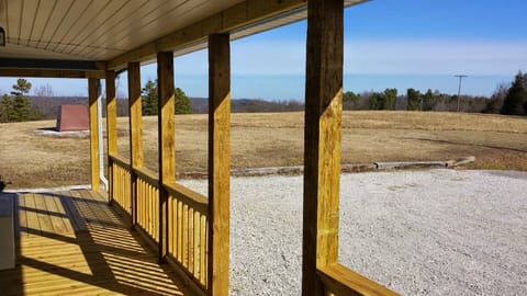 View from deck of cabin to  pasture rolling into the Ozark National Forest