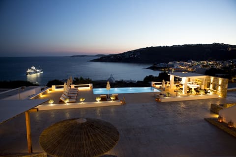 Seasonal outdoor pool, open 8:00 AM to 9:00 PM, pool umbrellas