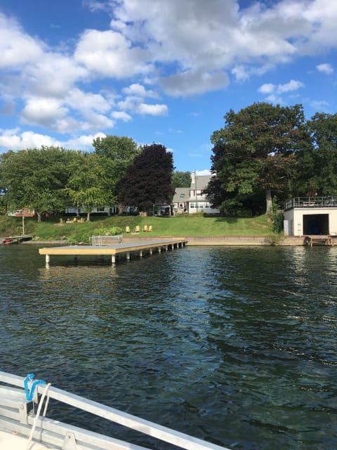 Beautiful lakefront property with fire pit and Adirondack chairs for relaxing