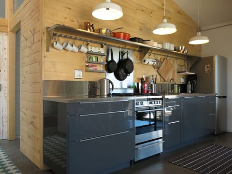 An open galley Kitchen has everything you need to cook your own meals.