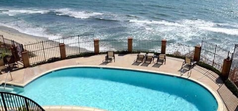pool in complex overlooking ocean. 