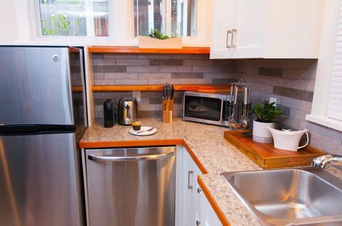 Full kitchen includes fridge/freezer, stove, oven, and dishwasher.