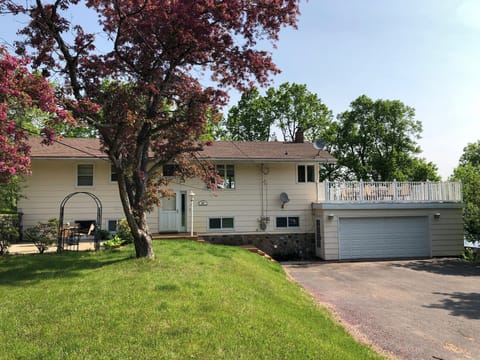 Front view- Notice the patio over the garage and 8 parking spots