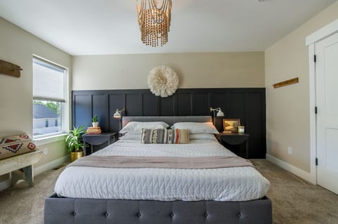 Luxurious king bed in master. All rooms feature installed reading lights