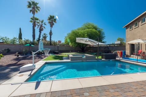 Heated pool with sauna and basketball hoop.